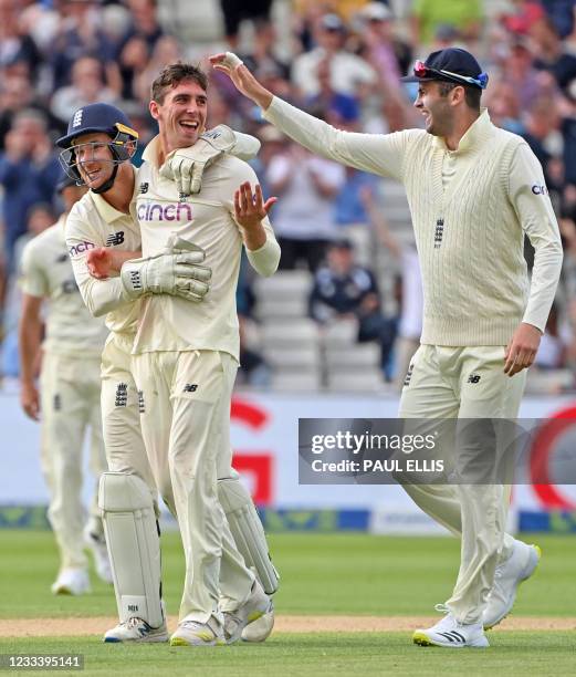 England's Dan Lawrence celebrates taking the wicket of New Zealand's Will Young with England's James Bracey during the second day of the second Test...