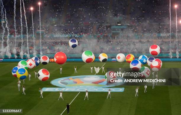 Entertainers perform during the opening ceremony before the UEFA EURO 2020 Group A football match between Turkey and Italy at the Olympic Stadium in...