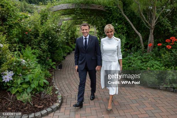 French President Emmanuel Macron and his wife Brigitte Macron attend a drinks reception for Queen Elizabeth II and G7 leaders at The Eden Project...