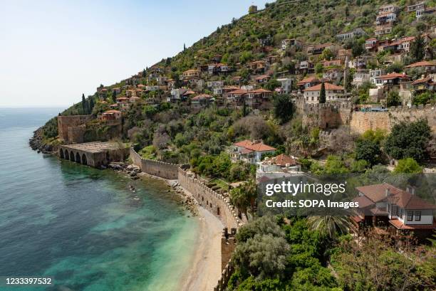 Beautiful view of Alanya peninsular and the old Shipyard and castle walls from the harbour. The Turkish seaside resort of Alanya, sits at the foot of...