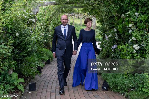 President of the European Council Charles Michel and his partner Amélie Derbaudrenghie arrive to attend a reception with G7 leaders at The Eden...