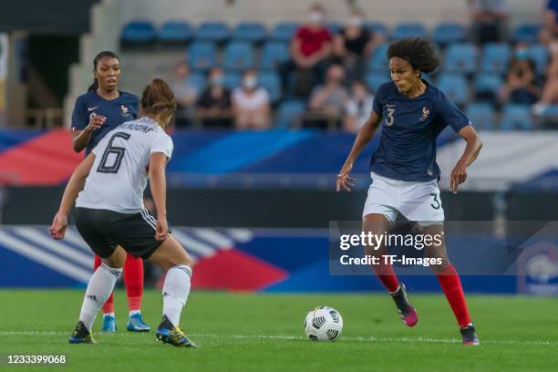 Grace Geyoro of France, Lena Sophie Oberdorf of Germany and Wendie Renard of France battle for the ball during the international friendly match...