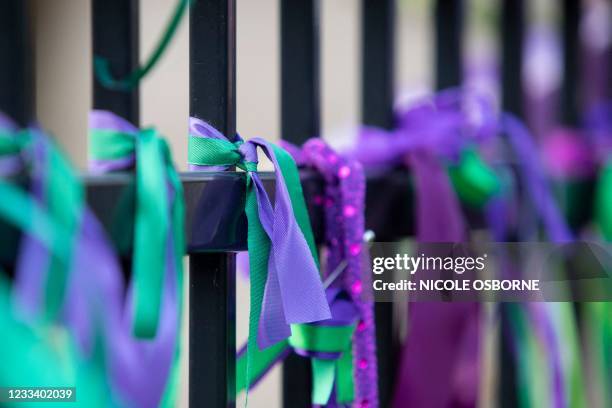 Ribbons are seen tied to the fence of the London Muslim Mosque during the multi-faith march to end hatred, after a man driving a pickup truck struck...