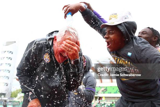 Head Coach Dennis Shaver of the LSU Tigers celebrates with his team after winning the championship during the Division I Men's and Women's Outdoor...