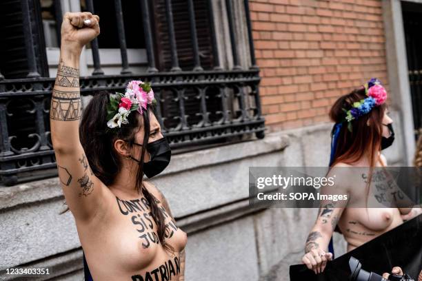 Protester seen making gestures in front of the Justice Ministry during the demonstration. Motivated by the killings of three women in 2 days and the...