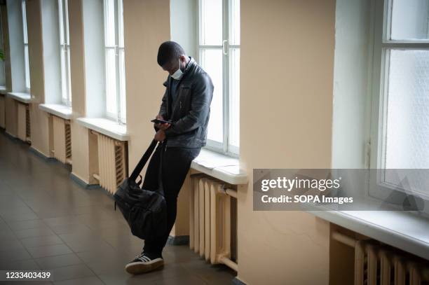 Tambov State University student seen wearing a facemask during break as a preventive measure against the spread of coronavirus. Russian universities,...