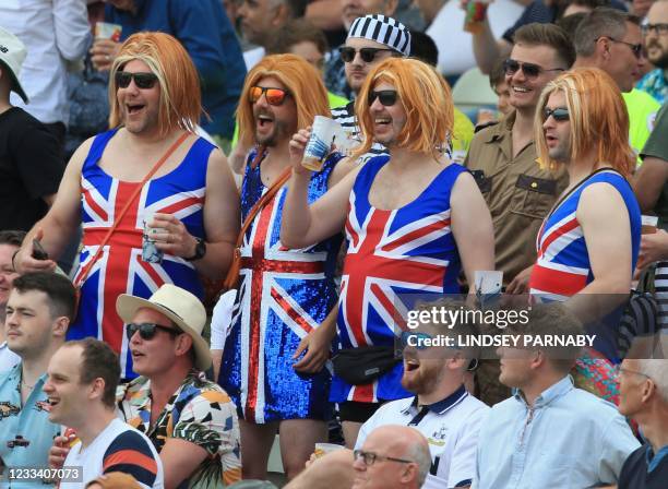 Fans wear outfits featuring the Union Flag as they enjoy the atmosphere on the third day of the second Test cricket match between England and New...