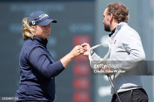 Caroline Hedwall of Sweden and Joost Luiten of the Netherlands fist bump on the 18th green during the third round of The Scandinavian Mixed Hosted by...