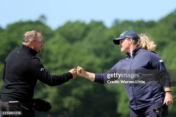 Caroline Hedwall of Sweden and Darren Fichardt of South Africa fist bump on the 18th green during the third round of The Scandinavian Mixed Hosted by...