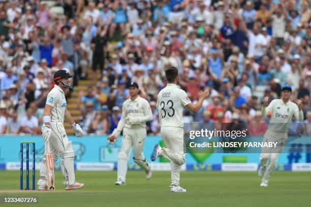 New Zealand's Henry Nicholls leaves the crease after being caught by England's James Bracey off the bowling of England's Mark Wood on the third day...