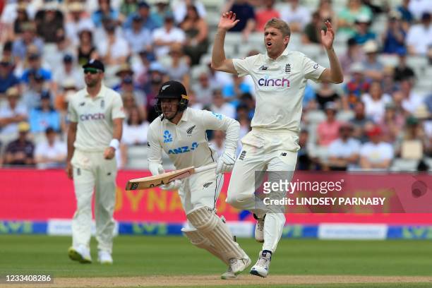 England's Olly Stone reacts while bowling on the third day of the second Test cricket match between England and New Zealand at Edgbaston Cricket...