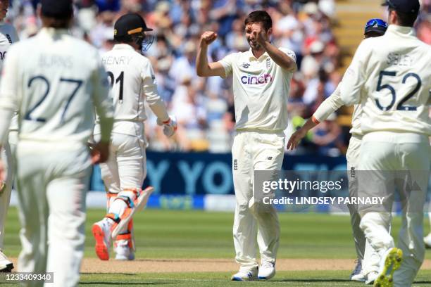 England's Mark Wood celebrates after trapping New Zealand's Matt Henry LBW during play on the third day of the second Test cricket match between...