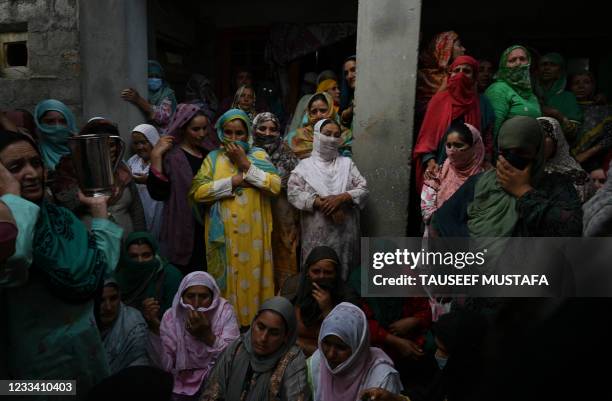Relatives and neighbours grieve during the funeral of a slain policeman, who died during an attack on Indian security personnel by suspected...