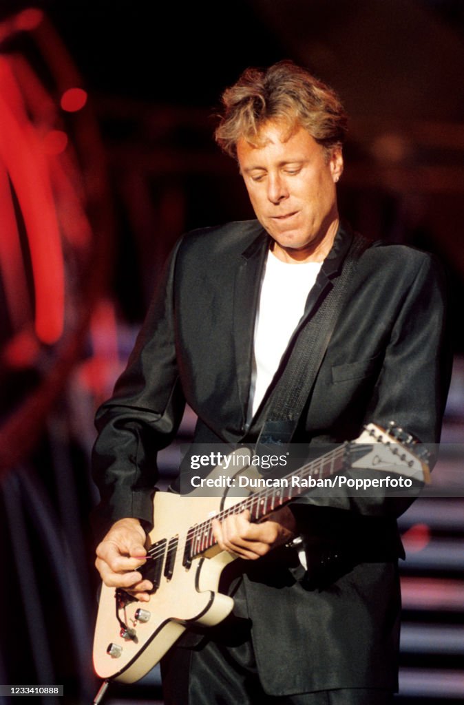 Guitarist James Ralston performing on stage as part of Tina Turner's ...