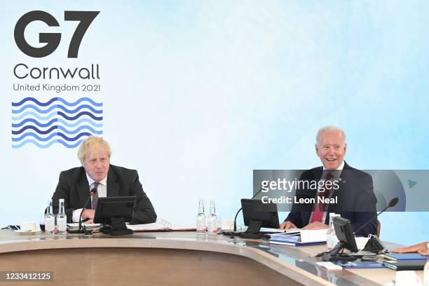 British Prime Minister Boris Johnson reacts next to US President Joe Biden at the G7 summit in Carbis Bay on June 12, 2021 in Carbis Bay, Cornwall....