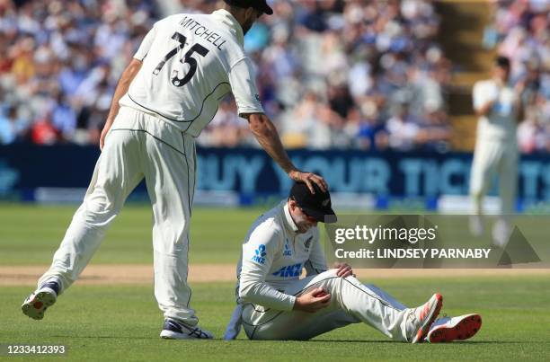 New Zealand's Daryl Mitchell pats New Zealand's Henry Nicholls on the head after a dropped catch on the third day of the second Test cricket match...