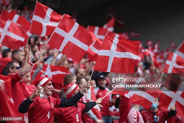 Denmark fans cheer before the UEFA EURO 2020 Group B football match between Denmark and Finland at the Parken Stadium in Copenhagen on June 12, 2021.