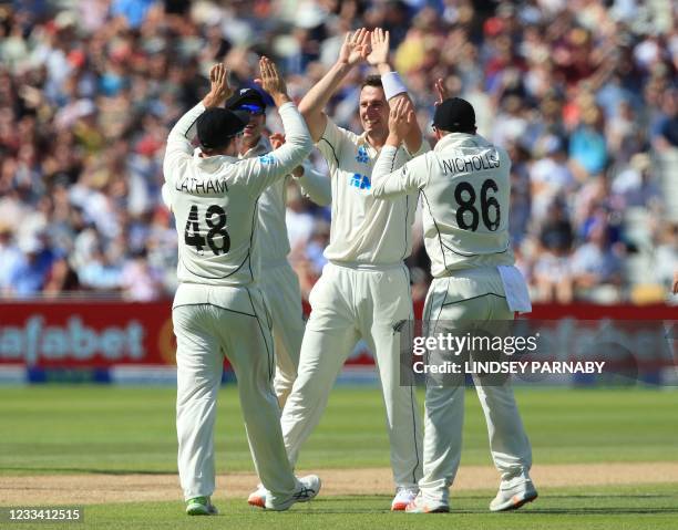 New Zealand's Matt Henry celebrates with teammates after bowling England's Zak Crawley for LBW on the third day of the second Test cricket match...