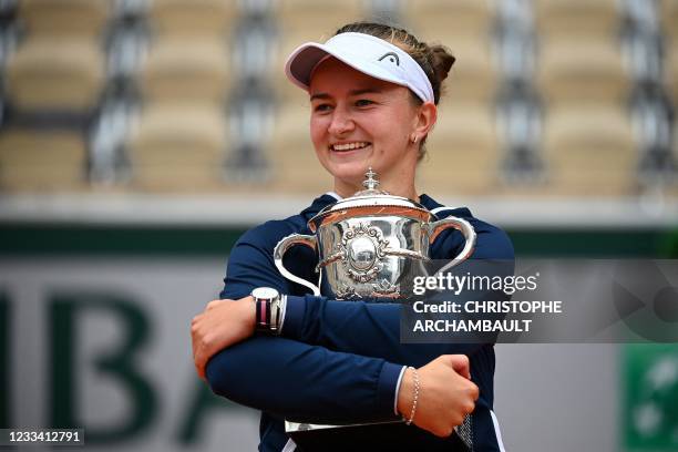 Czech Republic's Barbora Krejcikova celebrates with the Suzanne Lenglen Cup after winning the women's singles final tennis match against Russia's...