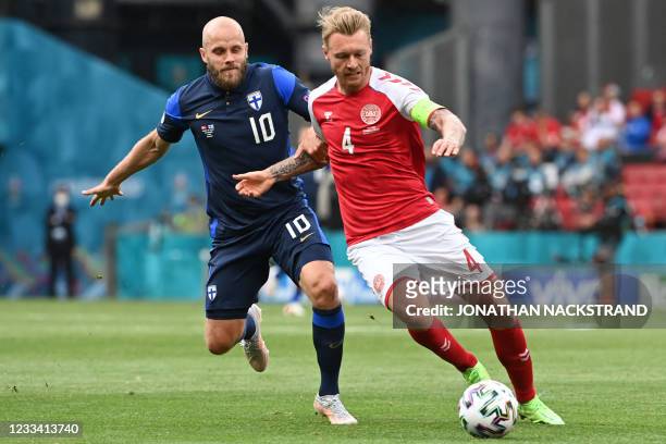 Finland's forward Teemu Pukki vies with Denmark's defender Simon Kjaer during the UEFA EURO 2020 Group B football match between Denmark and Finland...