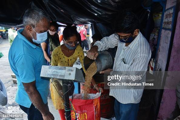 Food Rations Queue Citizens wait in queue for free ration of 3kg wheat and 2kg rice for ...