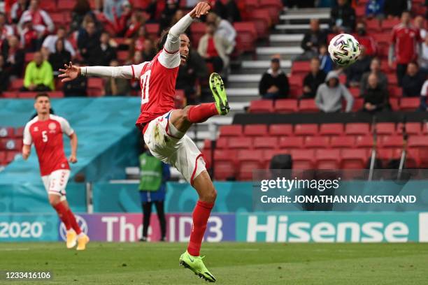 Denmark's forward Yussuf Poulsen kicks the ball during the UEFA EURO 2020 Group B football match between Denmark and Finland at the Parken Stadium in...