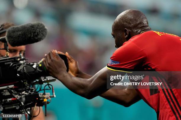 Belgium's forward Romelu Lukaku celebrates in front of a camera after scoring his team's first goal during the UEFA EURO 2020 Group B football match...