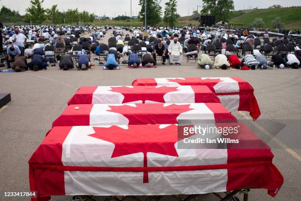 Mourners and supporters gather for a public funeral for members of the Afzaal family at the Islamic Centre of Southwest Ontario on June 12, 2021 in...