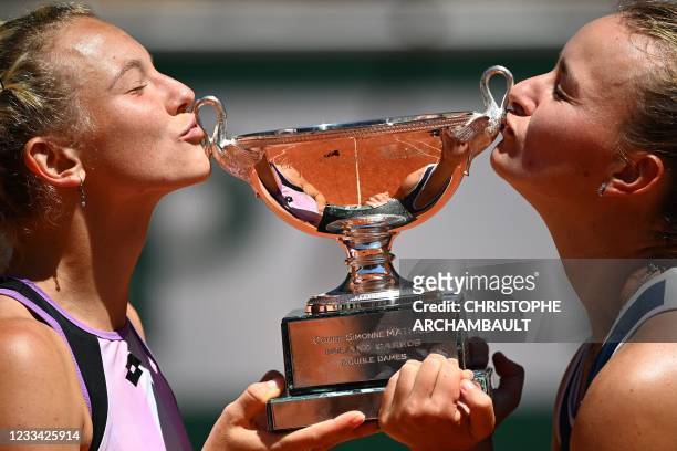 Czech Republic's Barbora Krejcikova and Czech Republic's Katerina Siniakova kiss The Simonne Mathieu Cup after winning their women's doubles final...