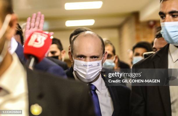 Naftali Bennett, Israeli parliament member from the Yamina party, waves as he arrives to attend a parliamentary meeting at the Knesset in Jerusalem,...