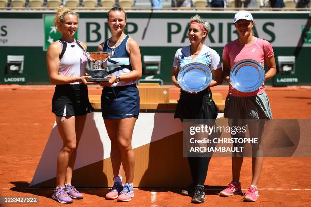 Winners Czech Republic's Katerina Siniakova and Czech Republic's Barbora Krejcikova and second-placed Bethanie Mattek-Sands of the US and Poland's...