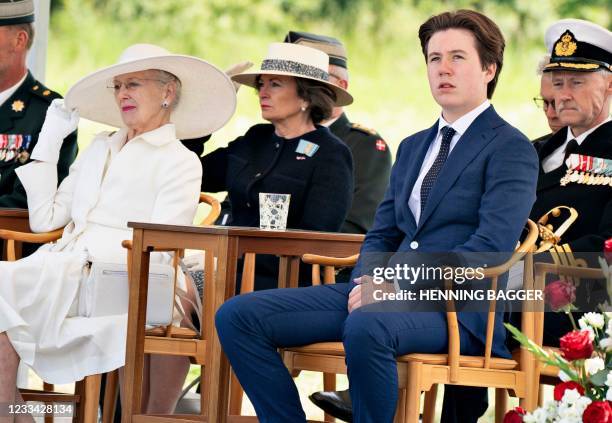 Prince Christian of Denmark sits next to his grandmother, Denmark's Queen Margrethe, as they take part in celebrations at the old border to Germany,...