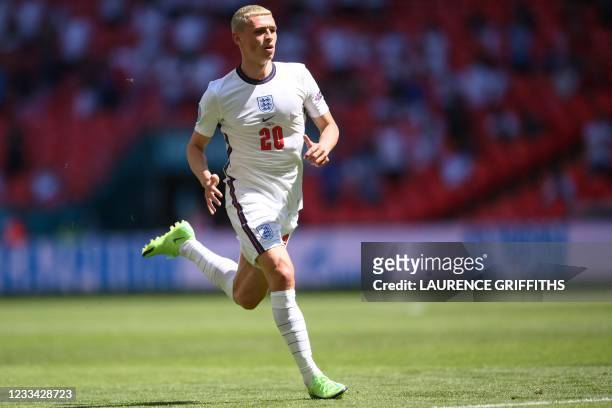 England's midfielder Phil Foden runs during the UEFA EURO 2020 Group D football match between England and Croatia at Wembley Stadium in London on...
