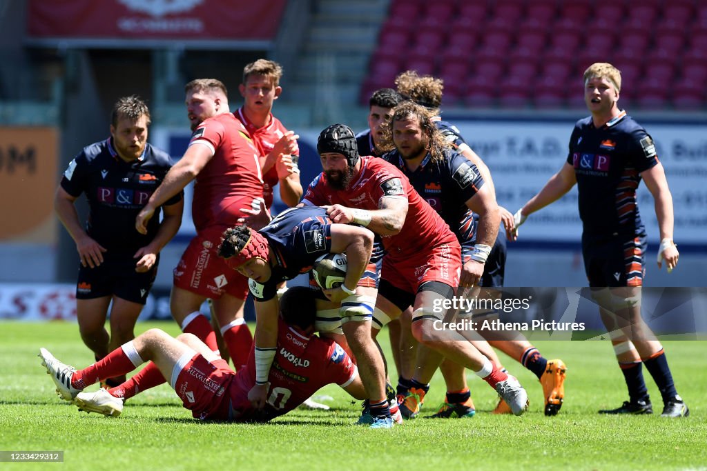 Connor Boyle Connor Boyle of Edinburgh Rugby is tackled by Dan Jones of Scarlets ...