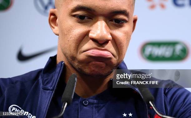 France's forward Kylian Mbappe gives a press conference at the team's training grounds in Clairefontaine-en-Yvelines, southwest of Paris, on June 13...