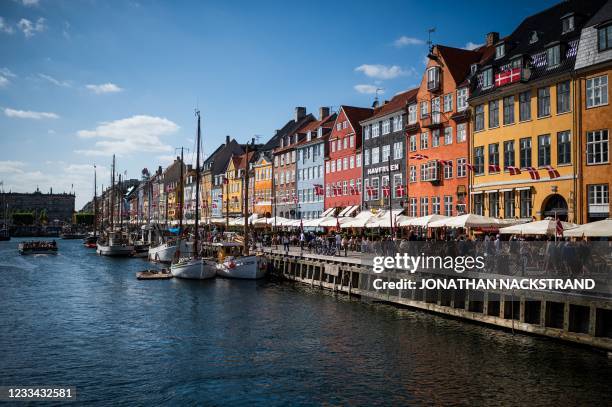 Picture taken on June 13, 2021 shows the Nyhavn, a 17th-century waterfront, canal and tourists attraction in Copenhagen, Denmark.