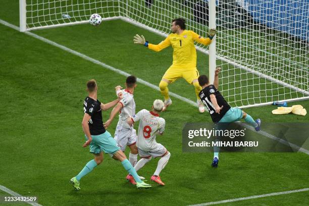 Austria's defender Stefan Lainer scoring the opening goal during the UEFA EURO 2020 Group C football match between Austria and North Macedonia at the...