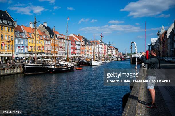 Picture taken on June 13, 2021 shows the Nyhavn, a 17th-century waterfront, canal and tourists attraction in Copenhagen, Denmark.