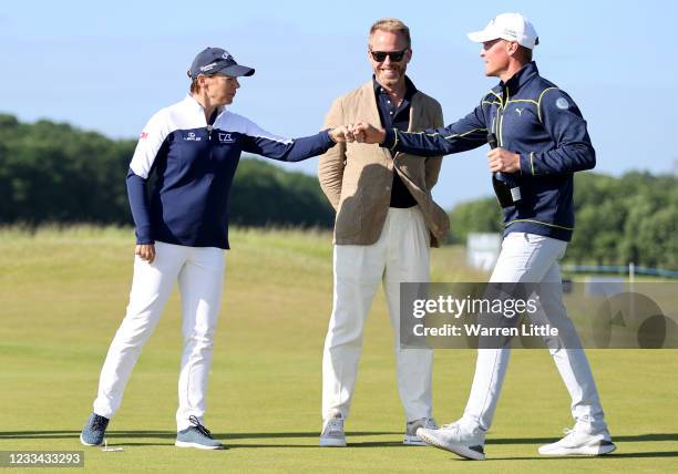 Annika Sorenstam of Sweden congratulates low Amateur Vincent Norrman of Sweden at the trophy presentation during the final round of The Scandinavian...