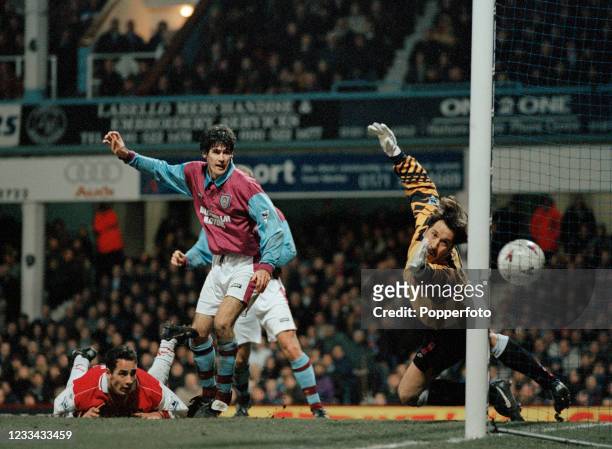 Matthew Rose of Arsenal scores an own goal past his goalkeeper David Seaman as Mike Newell of West Ham United looks on during an FA Carling...