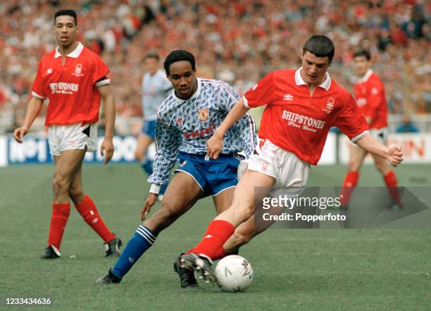 Roy Keane of Nottingham Forest is tracked by Paul Ince of Manchester United as Des Walker of Nottingham Forest looks on during the Rumbelows Football...