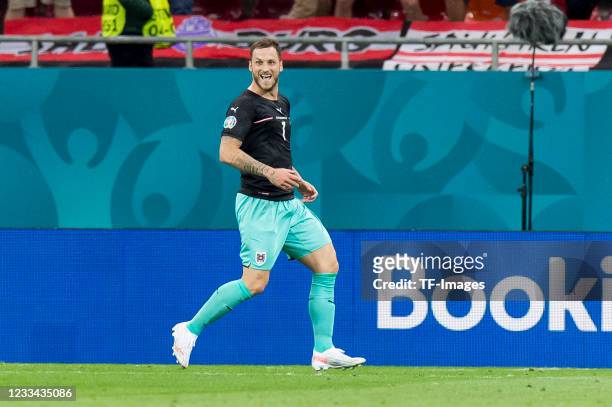 Marko Arnautovic of Austria celebrates after scoring his team's third goal during the UEFA Euro 2020 Championship Group C match between Austria and...