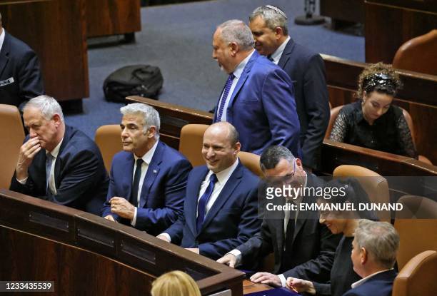 Members of Israel's newly-sworn government Defence Minister Benny Gantz, Alternate Prime Minister and Foreign Minister Yair Lapid, Prime Minister...