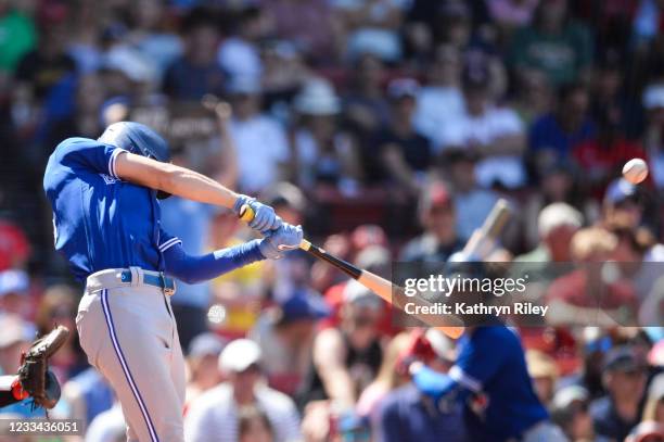 Cavan Biggio of the Toronto Blue Jays hits a solo home run in the sixth inning against the Boston Red Sox at Fenway Park on June 13, 2021 in Boston,...