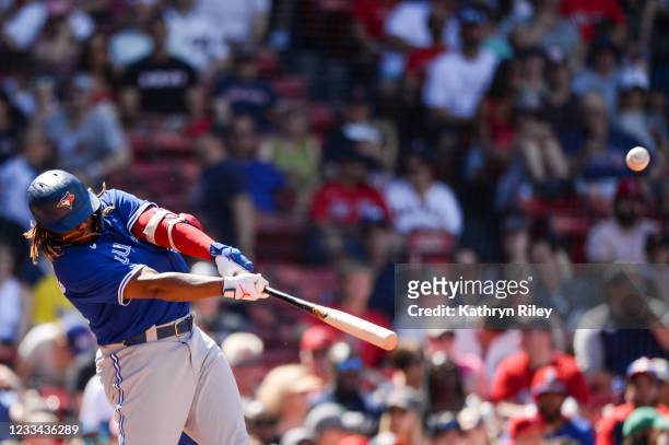 Vladimir Guerrero Jr. #27 of the Toronto Blue Jays hits a two-run home run in the seventh inning against the Boston Red Sox at Fenway Park on June...