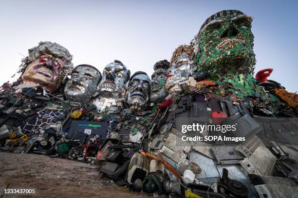 Statue made out of electrical waste representing the G7 leaders is built on sandy Acres. Environmental Protest Groups gather in Cornwall as the UK...