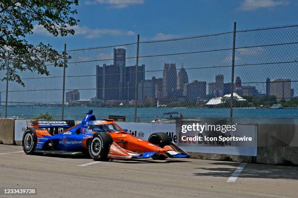 Indy Car series driver Scott Dixon drives along the Detroit River with the Detroit city skyline in the background during the Chevrolet Detroit Grand...