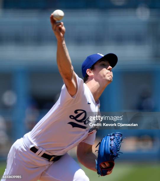 Starting pitcher Walker Buehler of the Los Angeles Dodgers throws against the Texas Rangers during the first inning of their inter league game at...