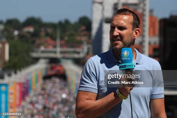 Mark Schwarzer is seen working for Australian broadcaster Optus Sport during the UEFA Euro 2020 Championship Group D match between England and...