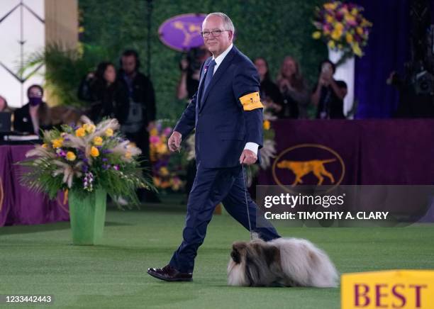 David Fitzpatrick with his Pekingese "Wasabi" are seen after winning Best in Show at the 145th Annual Westminster Kennel Club Dog Show June 13, 2021...